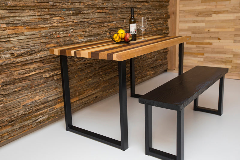Black wooden spruce bench with a clean, modern design and sturdy legs, perfect for both indoor and outdoor spaces.