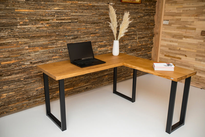 Industrial style corner office desk with a metal frame and wooden top, featuring a minimalist design and spacious work surface.