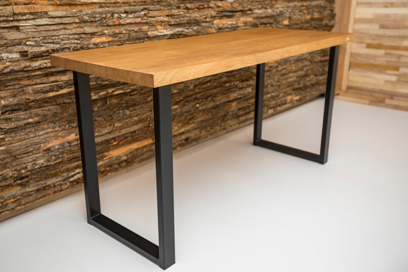 Industrial style oak desk with a sturdy wood surface and metal frame, combining rustic and modern elements for a unique look.