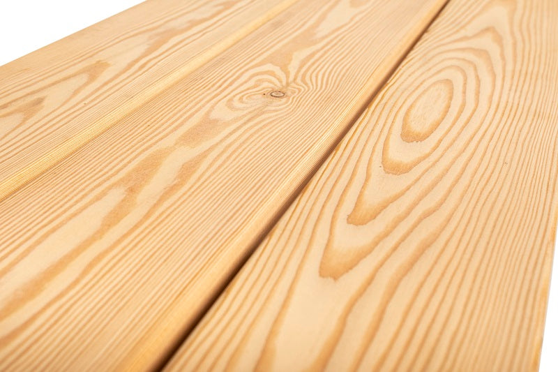 Larch wood outdoor table set with benches, natural finish and sturdy black metal legs.