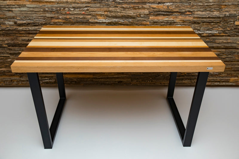 Multi-color dining table with a vibrant design, blending various hues for a bold and modern look in any dining space.