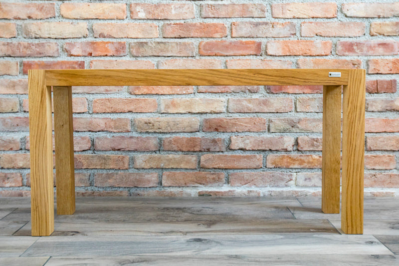 Natural oak bench with a sleek, minimalist design, perfect for adding warmth and style to any room or entryway.