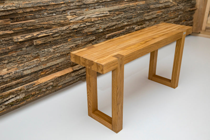 Natural oak rectangle bench with a smooth finish, offering a simple yet elegant seating option for any space.