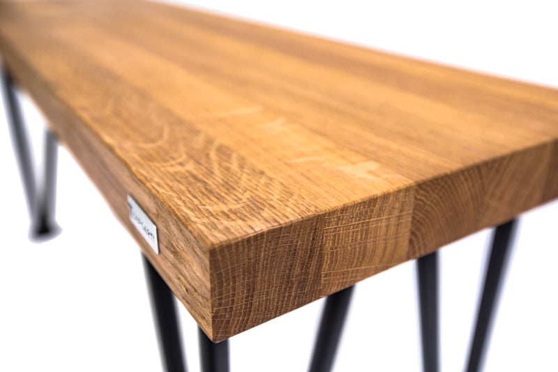 Scandinavian-style hairpin oak bench with a minimalist design, natural wood finish, and sleek metal legs for a modern touch.