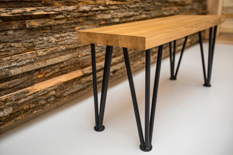 Scandinavian-style hairpin oak bench with a minimalist design, natural wood finish, and sleek metal legs for a modern touch.