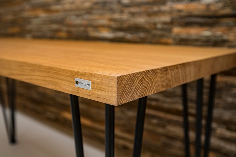 Scandinavian-style hairpin oak dining table with a clean design, natural wood finish, and sleek metal legs for a modern touch.