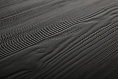 Black spruce desk with a sleek, modern design and spacious surface, perfect for home or office use.