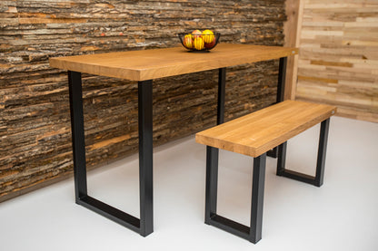 Industrial style oak dining table with a sturdy wood surface and metal frame, blending rustic and modern design elements.