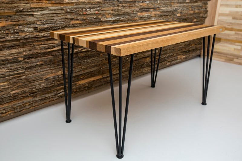 Multi-color hairpin dining table with a vibrant design and sleek metal legs, adding a bold touch to any dining space.